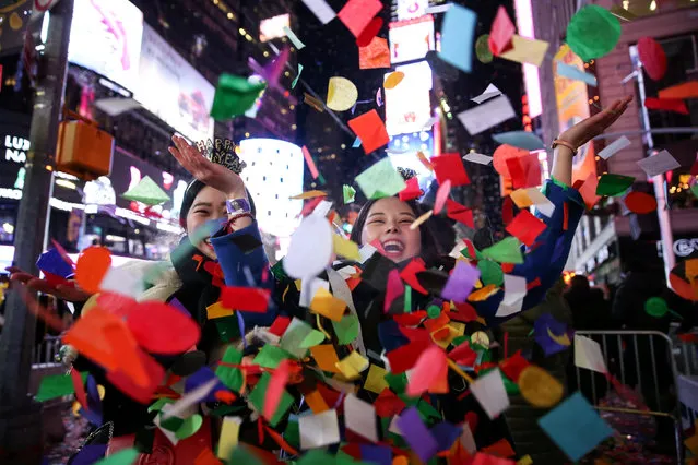 Revelers celebrate the New Year in Times Square in Manhattan, New York, U.S., January 1, 2018. (Photo by Amr Alfiky/Reuters)