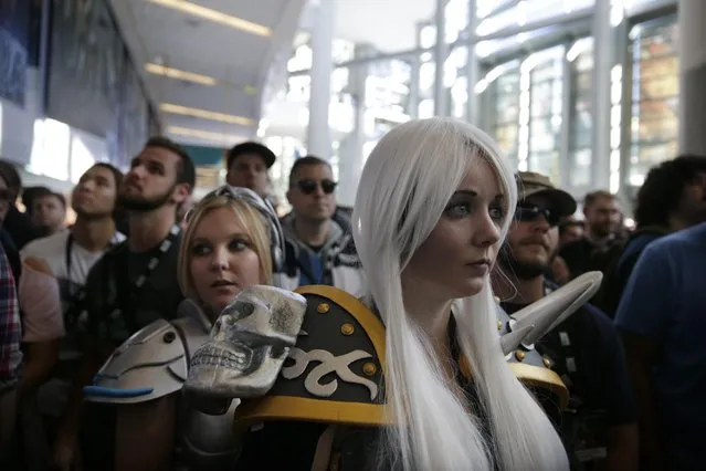 Attendees wait for the start of the opening ceremony at BlizzCon, Friday, November 6, 2015, in Anaheim, Calif. "World of Warcraft" maker Blizzard is hosting its ninth annual fan-centric convention opening Friday. (Photo by Jae C. Hong/AP Photo)