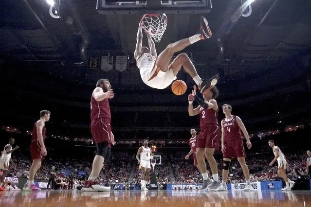 Texas' Christian Bishop dunks during second half of a first-round college basketball game against Colgate in the NCAA Tournament Thursday, March 16, 2023, in Des Moines, Iowa. (Photo by Charlie Neibergall/AP Photo)