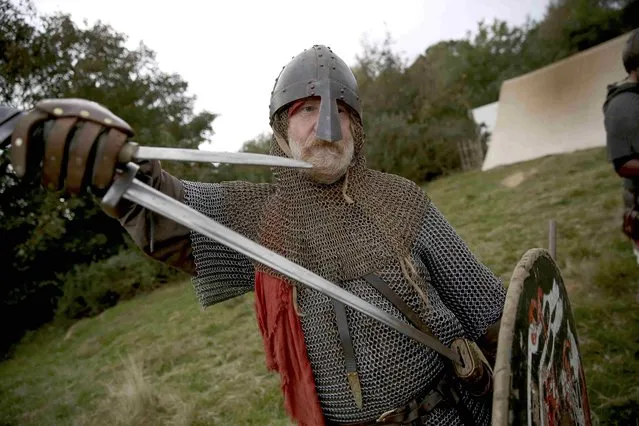 Re-enactors dress in historical costume as part of the Battle of Hastings anniversary commemoration events in Battle, Britain October 15, 2016. (Photo by Neil Hall/Reuters)