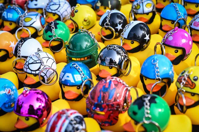 Keychains in the shape of small yellow rubber ducks are seen for sale on November 22, 2020 in Bangkok, Thailand. Students and “red shirt” demonstrators held a carnival-themed pro-democracy protest on Sunday, as part of a series of protests that have taken place demanding constitutional reforms. (Photo by Sirachai Arunrugstichai/Getty Images)