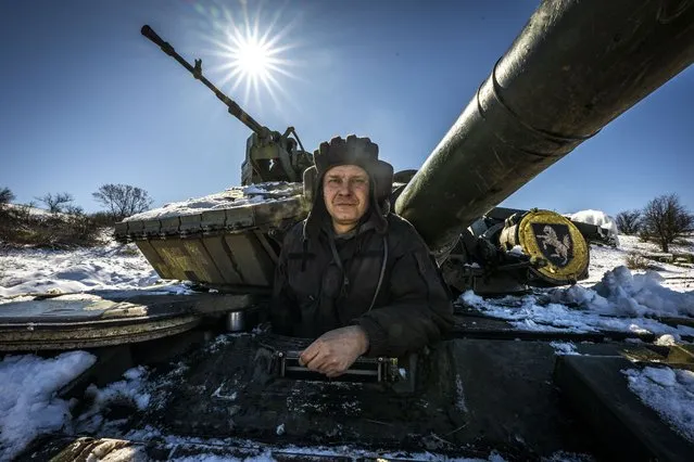 A Ukrainian soldier is on the snow covered tank amid Russia-Ukraine war in Donetsk Oblast, Ukraine on March 31, 2023. Military aid is provided by a framework of “tank coalition” formed by European countries last year. Commander of code named “Lishiy” of tank troop expectantly waits for arriving of modern tanks to the frontline. (Photo by Muhammed Enes Yildirim/Anadolu Agency via Getty Images)