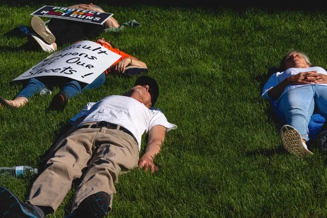 Demonstrators stage a die-in during a protest outside the National Rifle Association (NRA) annual convention in Indianapolis, Indiana, US, on Saturday, April 15, 2023. Days after a mass shooting in Louisville, Kentucky, many declared and undeclared 2024 candidates will be brandishing their Second Amendment bona fides at the National Rifle Association's annual leadership forum in Indianapolis, Politico reports. (Photo by Jon Cherry/Bloomberg)