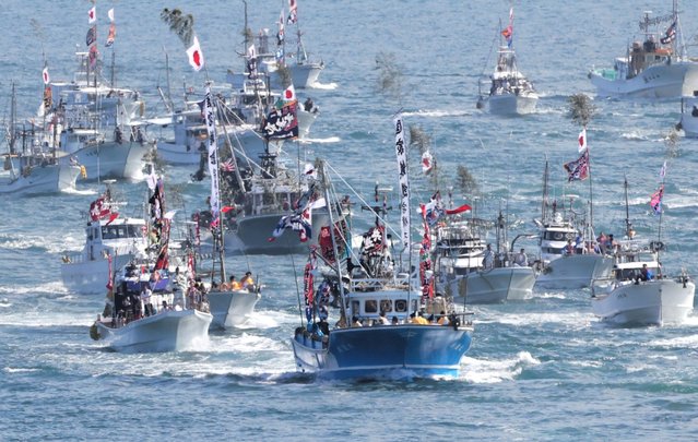 A fleet of boats including the sacred vessel carrying the deity heads toward Kounominato Port on October 1, 2025 in Munakata, Fukuoka, Japan. (Photo by The Asahi Shimbun via Getty Images)