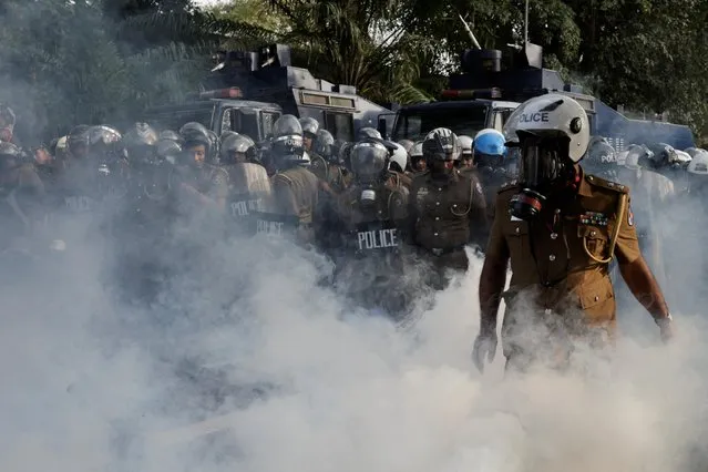 Police use tear gas to disperse Inter University students federation members during a protest demanding the implementation of the promised changes to the governing system, in Colombo, Sri Lanka on March 7, 2023. (Photo by Dinuka Liyanawatte/Reuters)