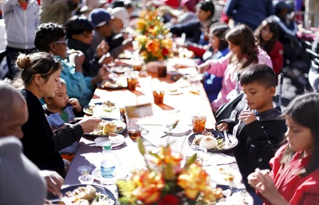 An early Thanksgiving meal is served to the homeless at the Los Angeles Mission in Los Angeles, California, November 25, 2015. (Photo by Mario Anzuoni/Reuters)