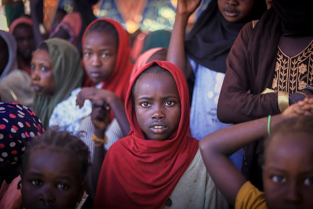 This photo released by The Norwegian Refugee Council (NRC), shows displaced women and children from el-Fasher at a camp where they sought refuge from fighting between government forces and the RSF, in Tawila, Darfur region, Sudan, Monday, November 3, 2025. (Photo by Marwan Mohammed/NRC via AP Photo)