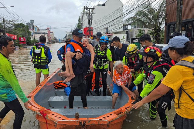 Rescuers evacuate local residents from their homes, which are partially submerged in a flooded area in Hat Yai district, affected by heavy rainfall, which has impacted several provinces in southern Thailand and has killed several people, in Songkhla province, Thailand, on November 25, 2025. (Photo by Sithichai Chootochan/Reuters)