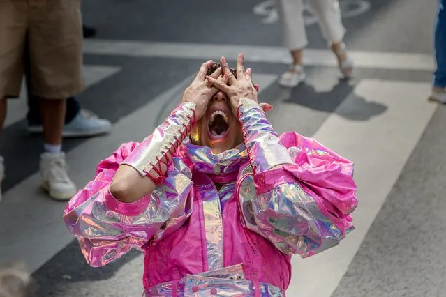 A participant gives an artistic performance during the annual Pride Parade celebrations on May 20, 2023 in Brussels, Belgium. More than 150,000 people celebrated the annual Pride parade in the center of Brussels today. The Belgian and European Pride demonstration began with a rally at the Pride Village on Mont des Arts from noon, followed by a parade led by a large rainbow flag through the streets of the center of the European capital. (Photo by Omar Havana/Getty Images)