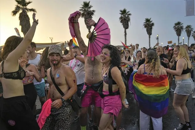 People dance during the annual Pride Parade in Tel Aviv, Israel, Thursday, June 8, 2023. (Photo by Ohad Zwigenberg/AP Photo)