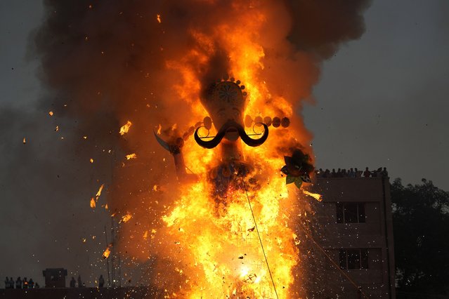 An effigy of mythical demon king Ravana goes up in flames marking the end of Dussehra festival in Jammu, India, Saturday, October 12, 2024. (Photo by Channi Anand/AP Photo)