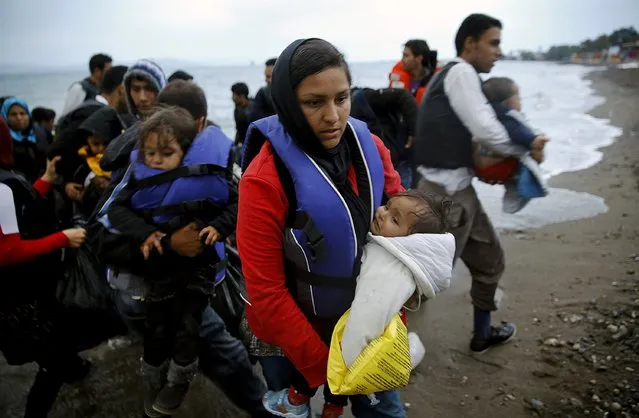 Afghan migrants land at a beach on the Greek island of Kos after crossing a portion of the south-eastern Aegean Sea between Turkey and Greece on a dinghy early May 27, 2015. Despite the bad weather the dinghy with over thirty migrants made the dangerous voyage to Greece. The number of refugees and migrants landing in Europe by sea crossing could reach 1 million this year, the U.N. says. (Photo by Yannis Behrakis/Reuters)