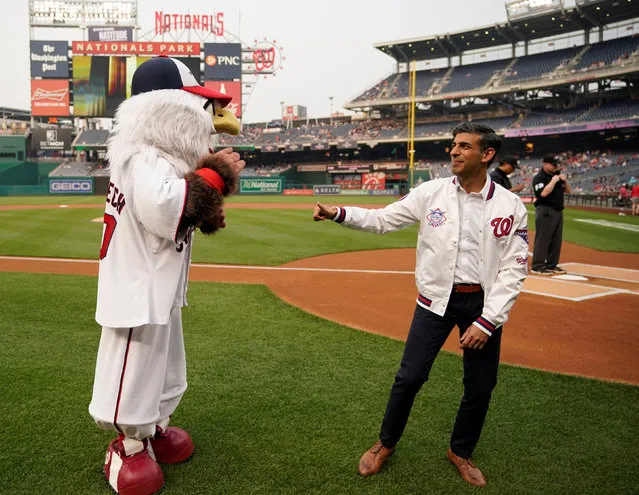 Prime Minister Rishi Sunak poses for pictures with Screech the Washington Nationals Mascot while attending the Washington Nationals v Arizona Diamondbacks baseball at Nationals Park during his visit to Washington DC in the US on Wednesday, June 7, 2023. (Photo by Niall Carson/Pool via Reuters)