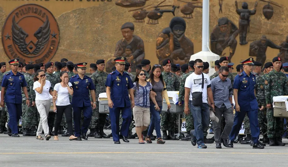 Bodies of 42 Elite Cops Arrive at Villamor Air Base
