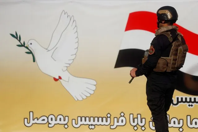 A security officer guards the area ahead of Pope Francis' visit to Mosul, Iraq, March 7, 2021. (Photo by Yara Nardi/Reuters)