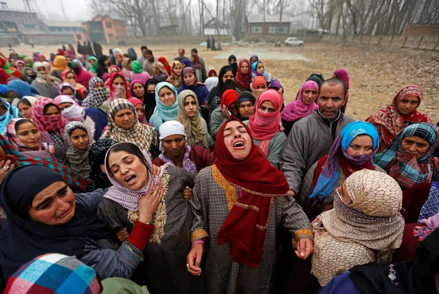 Women mourn during the funeral of suspected militant Rayees Ahmad Dar, who according to local media was killed in an encounter with the Indian armed forces in Pulwama district on Saturday afternoon, in Kakapora village, south of Kashmir, November 20, 2016. (Photo by Danish Ismail/Reuters)