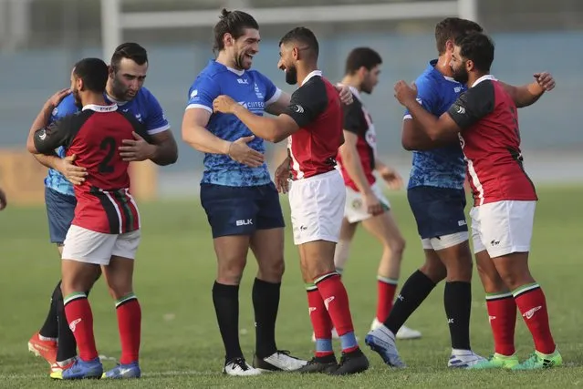 UAE and Israel rugby players celebrate with each other after a friendly match in Dubai, United Arab Emirates, Friday, March 19, 2021. (Photo by Kamran Jebreili/AP Photo)