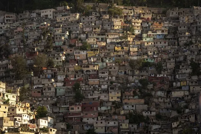 Houses blanket a hillside in Port-au-Prince, Haiti, Sunday, June 4, 2023. (Photo by Ariana Cubillos/AP Photo)