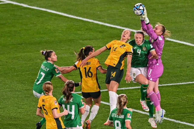 Ireland's goalkeeper Courtney Brosnan (R) makes a save during the Australia and New Zealand 2023 Women's World Cup Group B football match between Australia and Ireland at Stadium Australia, also known as Olympic Stadium, in Sydney on July 20, 2023. (Photo by Izhar Khan/AFP Photo)
