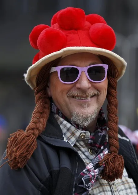 A man dressed in a costume of Black Forest woman poses at “Weiberfastnacht” (Women's Carnival) in Cologne February 12, 2015. (Photo by Ina Fassbender/Reuters)
