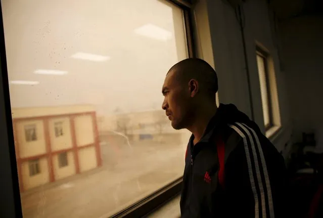 A drug addict looks out of a window at a newly-opened treatment centre at Camp Phoenix, in Kabul, Afghanistan January 3, 2016. (Photo by Ahmad Masood/Reuters)
