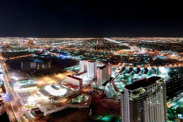 A lone figure (far left) looks out at the city from the unfinished Fontainebleau Las Vegas, a US$2.9 billion, 3,889-room, 68-story unfinished hotel/condo-hotel/casino development in Las Vegas. (Photo by Bradley L. Garrett/Barcroft Media)