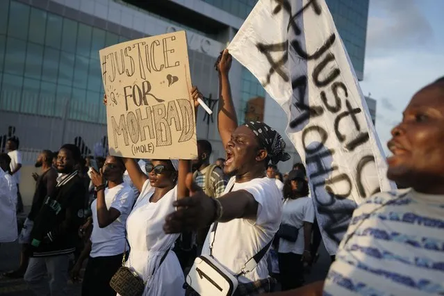 People chant slogans during a protest on the streets of Lagos, Nigeria, Thursday, September 21, 2023,  to demand justice following the mysterious death of Afrobeat star Mohbad. Lagos police said the body of the late Ilerioluwa Aloba, better known as MohBad, was exhumed Thursday afternoon in response to complaints about the unclear circumstances surrounding his death. (Photo by Sunday Alamba/AP Photo)