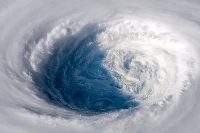 Super typhoon Trami is seen from the International Space Station as it moves towards Japan on September 25, 2018. Trami is expected to make landfall in the Japanese island of Okinawa. It is likely to bring 125-250mm (5-10in) of heavy rain, as well as hurricane-force winds and storm surges. (Photo by Alexander Gerst/Soci ESA/NASA via Reuters)