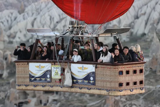 A general view of a hot air balloon, almost 556,306 local and foreign tourists get on within January-October period of this year, gliding over the historical Cappadocia, which is on the UNESCO World Heritage List, in Nevsehir, Turkiye on November 7, 2023. (Photo by Behcet Alkan/Anadolu via Getty Images)