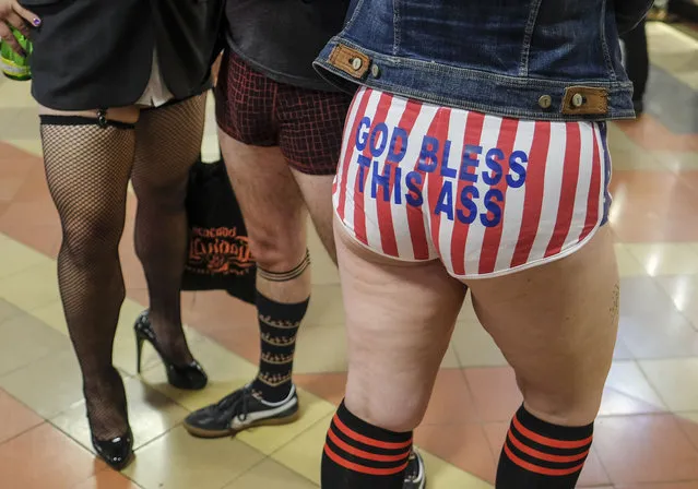 Participants in the 11th Annual No Pants Metro Ride at Union Station on January 13, 2019,  in Los Angeles. (Photo by Ringo Chiu/ZUMA Wire)