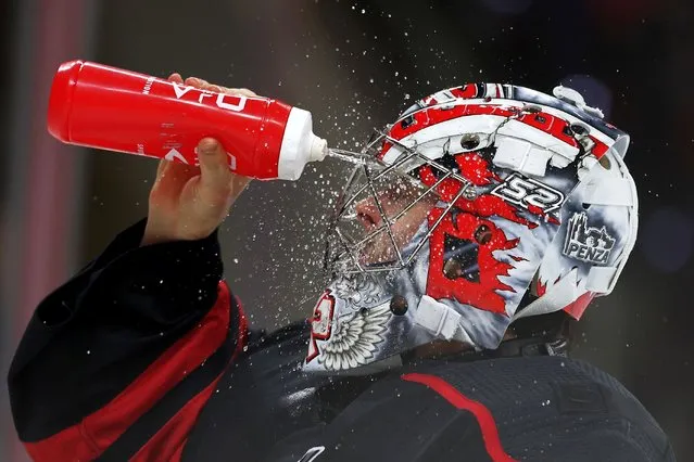 Pyotr Kochetkov #52 of the Carolina Hurricanes sprays water onto his face during the third period of the game against the Vegas Golden Knights at PNC Arena on December 19, 2023 in Raleigh, North Carolina. (Photo by Jared C. Tilton/Getty Images)