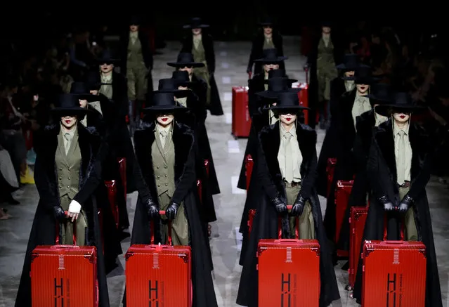 Models present creations by designer Hu Sheguang at China Fashion Week in Beijing, China, March 25, 2019. (Photo by Jason Lee/Reuters)