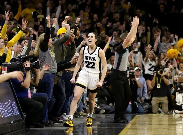 Caitlin Clark #22 of the Iowa Hawkeyes celebrates after breaking the NCAA women's all-time scoring record during the first half against the Michigan Wolverines at Carver-Hawkeye Arena on February 15, 2024 in Iowa City, Iowa. (Photo by Matthew Holst/Getty Images)