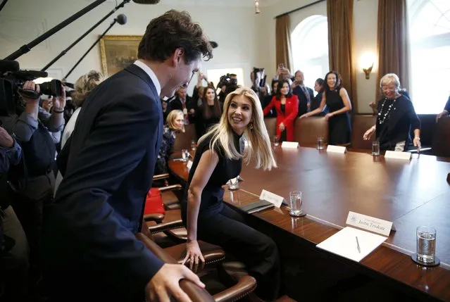 Canadian Prime Minister Justin Trudeau arrives and takes his seat to participate in a roundtable discussion with Ivanka Trump (C) and women business leaders at the White House in Washington, U.S., February 13, 2017. (Photo by Kevin Lamarque/Reuters)