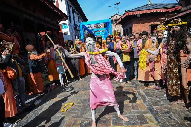 Sadhus or Hindu holy men smeared with ash take part in a religious procession ahead of the “Maha Shivaratri”, an annual festival dedicated to the Hindu god Shiva, at the Pashupatinath temple in Kathmandu on March 6, 2024. (Photo by Prakash Mathema/AFP Photo)
