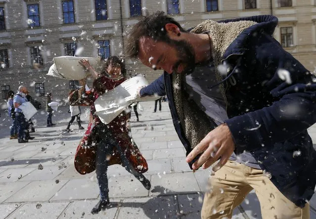 People fight with pillows during World Pillow Fight Day in Vienna, Austria, April 2, 2016. (Photo by Leonhard Foeger/Reuters)