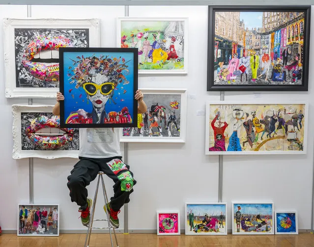 Wendy Helliwell, an artist who uses recycled materials and magazines, shows off her work at the Borders Art Fair in Kelso, Scotland on March 14, 2024 (Photo by Phil Wilkinson/The Times)