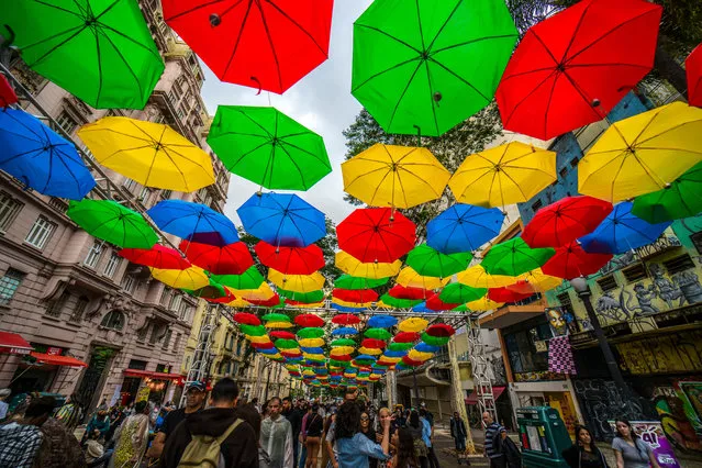An umbrella art installation brightens up the old centre of the city São Paulo, Brazil on May 22, 2019. (Photo by Cris Faga/Rex Features/Shutterstock)