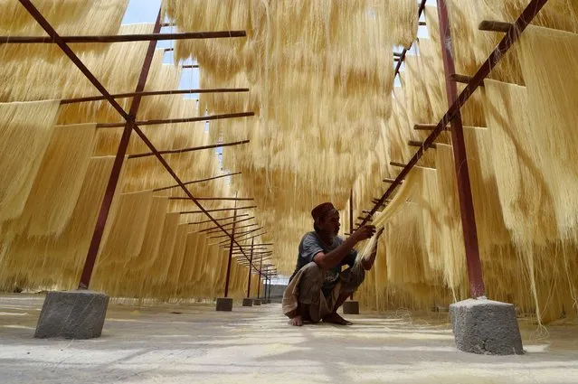 A worker prepares vermicelli at a workshop, during the holy fasting month of Ramadan, in Karachi, Pakistan, 27 March 2024. Vermicelli is used in the production of seviyan (vermicelli pudding), which is a very popular dessert, especially in the month of Ramadan. The Muslims' holy month of Ramadan is the ninth month in the Islamic calendar, and it is believed that the revelation of the first verse in the Koran was during its last 10 nights. It is celebrated yearly by praying during the night and abstaining from eating, drinking, and sexual acts during the period between sunrise and sunset. It is also a time for socializing, mainly in the evening after breaking the fast, and a shift of all activities to late in the day in most countries. (Photo by Shahzaib Akber/EPA/EFE)
