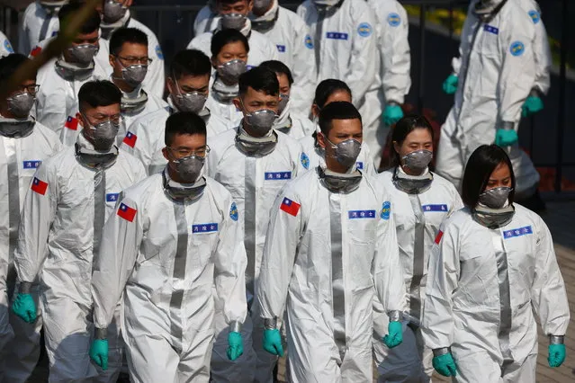 Soldiers in personal protective equipment (PPE) prepare for a visit by President Tsai Ing-wen in Taoyuan, Taiwan, February 1, 2021. (Photo by Ann Wang/Reuters)