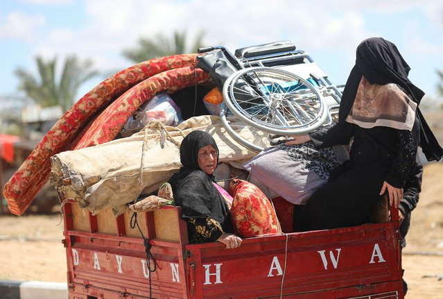 Displaced Palestinians, who fled Rafah after the Israeli military began evacuating civilians from the eastern parts of the southern Gaza city ahead of a threatened assault, amid the ongoing conflict between Israel and Hamas, travel in Al-Mawasi area, in Khan Younis in the southern Gaza Strip, on May 6, 2024. (Photo by Ramadan Abed/Reuters)