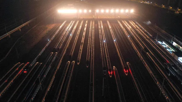Aerial photo taken on January 16, 2022 shows bullet trains in Nanjing, east China's Jiangsu Province. The Spring Festival travel rush, China's largest annual travel rush, will last from Jan. 17 to Feb. 25 this year. During the 40-day travel season, also known as chunyun, many Chinese people will travel to meet their families for the Chinese Lunar New Year, or Spring Festival, which will fall on Feb. 1, 2022. (Photo by Fang Dongxu/Xinhua News Agency)