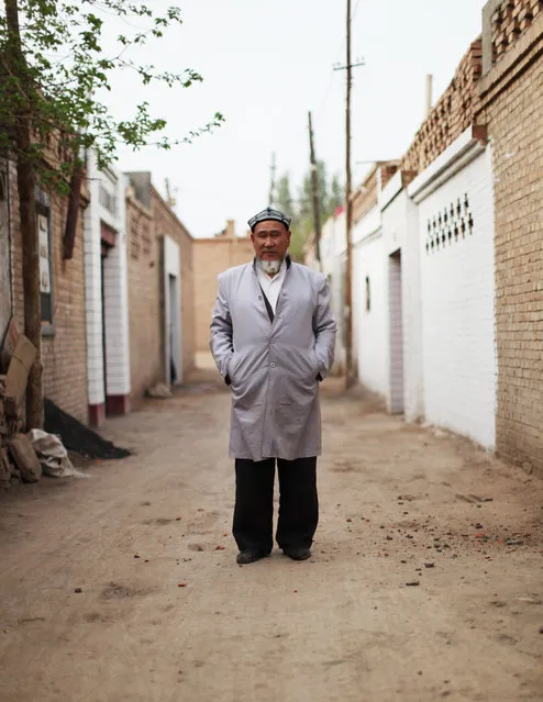 “Man in Alley”. A Uighur man poses for a portrait in Turpan, in April 2014. Photo location: Turpan, Xinjiang, China. (Photo and caption by Jake Fromm/National Geographic Photo Contest)