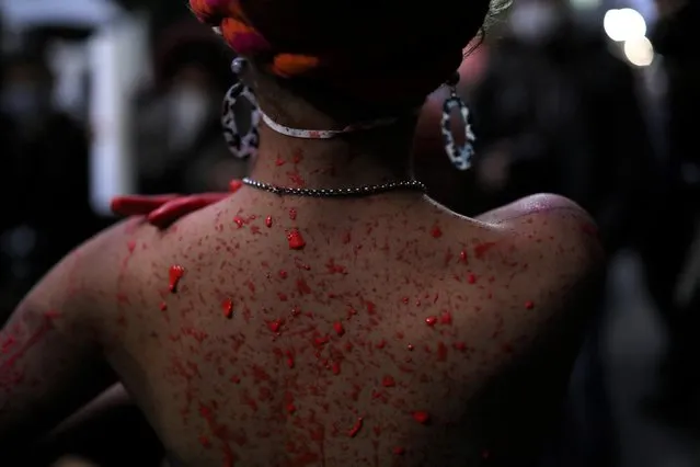 A Black movement activist covered by red paint attends a protest against racism and police violence, and against a police operation that took place at Jacarezinho slum in Rio de Janeiro, on the day that marks 133 years since the abolition of Slavery in the country, in Sao Paulo, Brazil, on May 13, 2021. (Photo by Amanda Perobelli/Reuters)