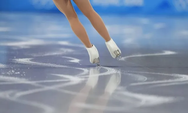 A skater warms-up ahead of the women's short program during the figure skating at the 2022 Winter Olympics, Tuesday, February 15, 2022, in Beijing. (Photo by David J. Phillip/AP Photo)