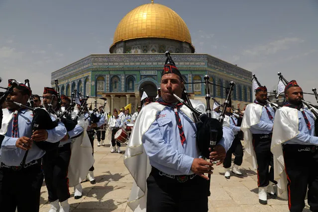 Palestinian scouts play music during the “Ascension of Prophet Mohammed” ceremony  next to the Dome of the Rock on the compound known to Muslims as Noble Sanctuary and to Jews as Temple Mount in Jerusalem's Old City  April 22, 2017. (Photo by Ammar Awad/Reuters)
