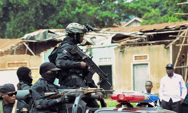 Uganda security forces patrol near the National Unity Platform (NUP) political party offices led by Robert Kyagulanyi, popularly known as Bobi Wine, ahead of anti-government protests at the Makerere Kavule, in the suburb of Kampala, Uganda on July 22, 2024. (Photo by Abubaker Lubowa/Reuters)