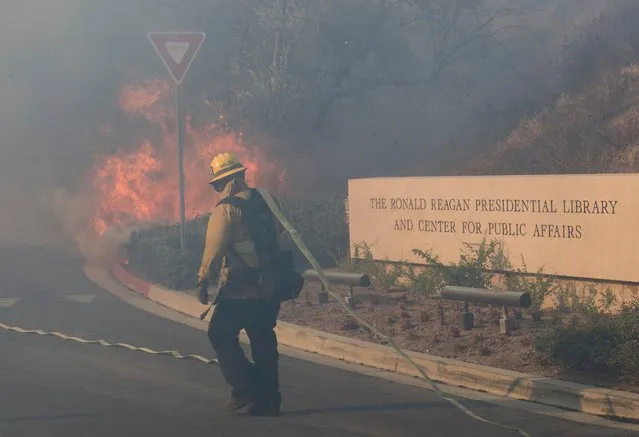 Firefighters battle to protect the Reagan Library from the Easy Fire in Simi Valley, Calif. on October 30, 2019. (Photo by Mark Ralston/AFP Photo)