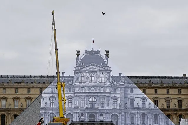 Rope access technicians paste a giant picture on the Louvre Pyramid as part of JR project in Paris, Tuesday, May 24, 2016. (Photo by Francois Mori/AP Photo)