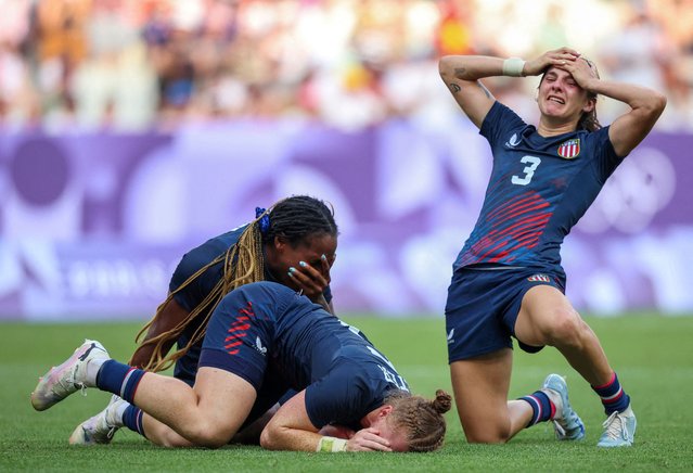 Naya Tapper, Alev Kelter and Kayla Canett of the United States celebrate after winning bronze in the women's rugby seven on July 30, 2024. (Photo by Phil Noble/Reuters)